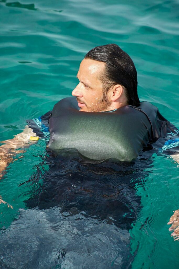 male wearing inflatable lifeshirt in water